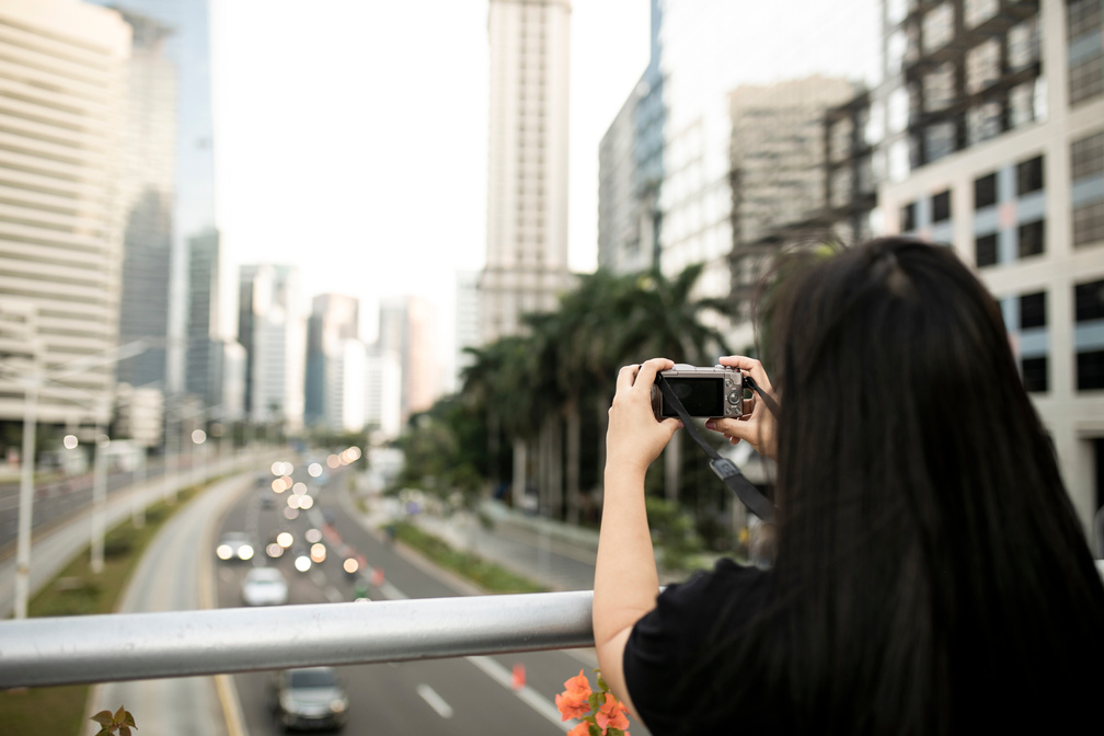 asian traveler woman taking picture