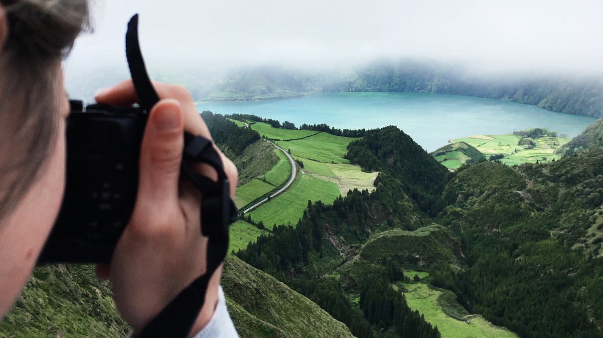 Girl Taking Travel Picture